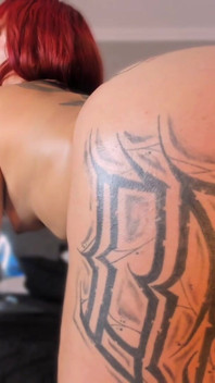 Latina Shakes Her Tattooed Butt