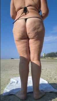 Hot Crown Sunbathing on the Beach in Transparent Micro Bikini