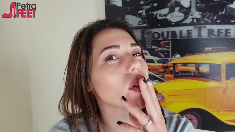 Smokin Fetish: Gorgeous brunette smokes a cigar in her bedroom