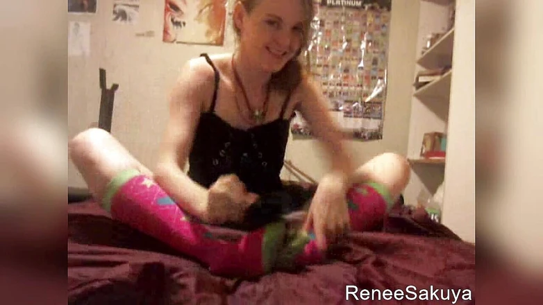 Renee Sakuya: Tickling feet with feather on bed, wearing long knee socks