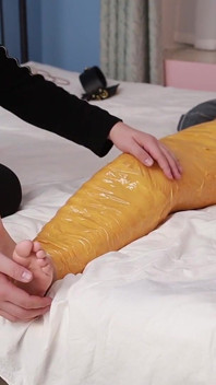 A Cute Barefoot Girlfriend Uses Tape to Bind Her Whole Body, Playing with Her Cute Bare Feet