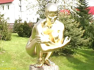 Real flexible contortionist gets golden painted