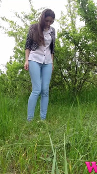 Skinny Brunette Just Had a Pee in the Tall Grass and Now She Puts on Her Jeans and Shoes