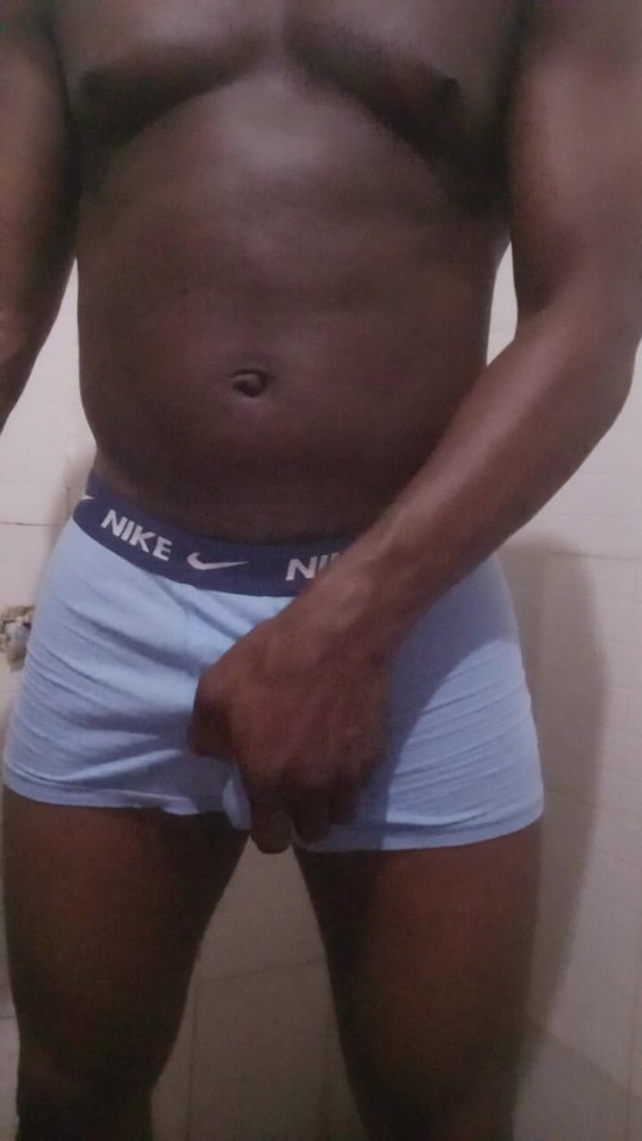 Enigmatic Buoy: Muscled Black Nigerian Guy Jerks off in the Bathroom.