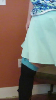 Nurse Vicki  plays with a rubber ball in a mini skirt, sexy stockings and high heel mini boots