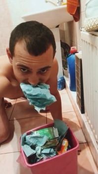 Toilet Slave Eats Toilet Paper From the Trash Can