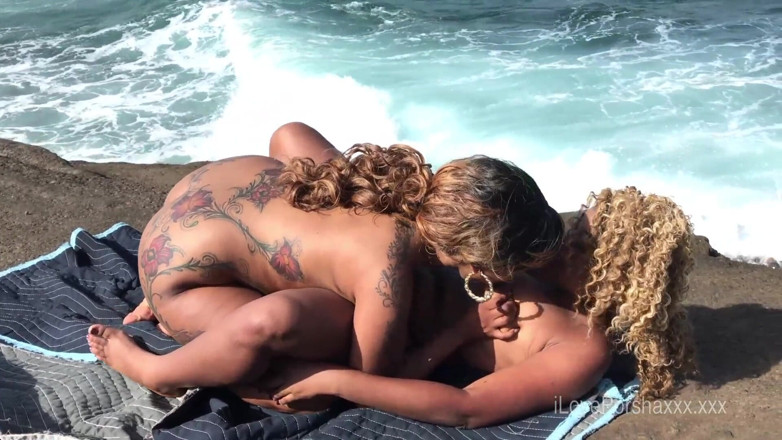 Porsha Carrera XXX: Ebony girls lick pussy on beach