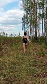 Pretty Woman Walking Through the Forest Showed Her Ass