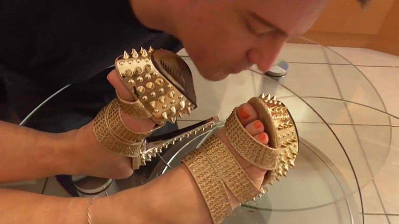 Foot Girls: Mistress lets her slave lick her golden shoes