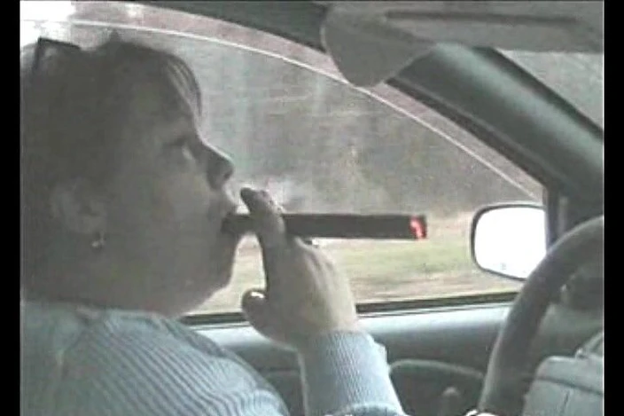 Smoking Dawn: Huge cigar in the car