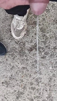 Friend Is Holding My Cock While Im Peeing on the Ground Outdoor