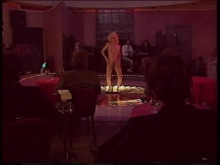 Irresistible Strippers: Blonde stripper bends showing shaved pussy