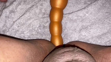 Taking a long butt plug
