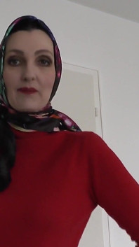 Lady Victoria Valente Showed Elegant Satin Headscarves with a Red Cashmere Turtleneck Sweater