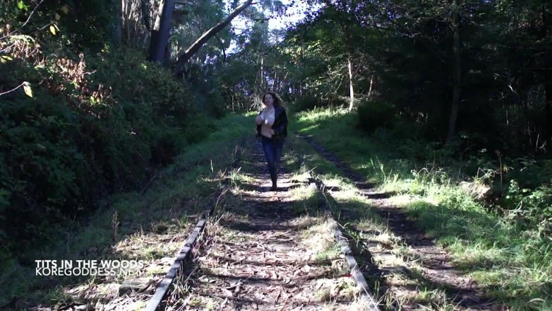 Kore Goddess: Huge tits in a rope harness roams the woods