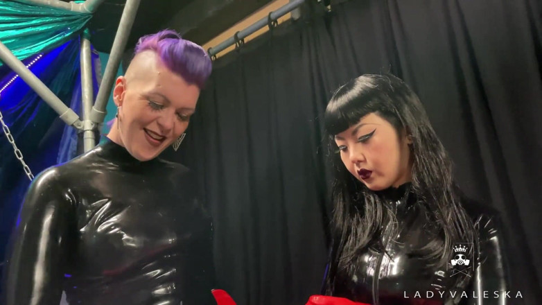 Lady Valeska: Latex Dommes invite you to suck their huge strap ons