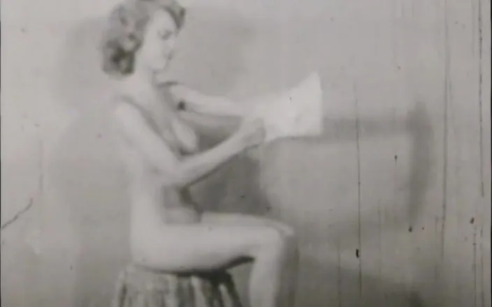 Vintage megastore: Vintage brunette beauty and a photographer