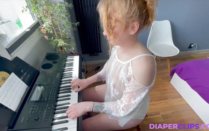 Nicole White: Playing on keyboard in diaper