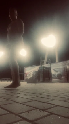 Eats Cigarette Butts and Trash From a Trash Can on the Street