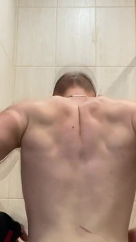 Alpha Shows off His Back Muscles