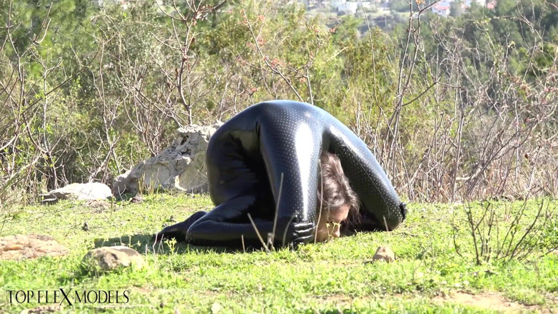 Flexilady: Flexible in a Black Catsuit