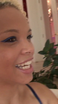 Ebony and brunette lick each other