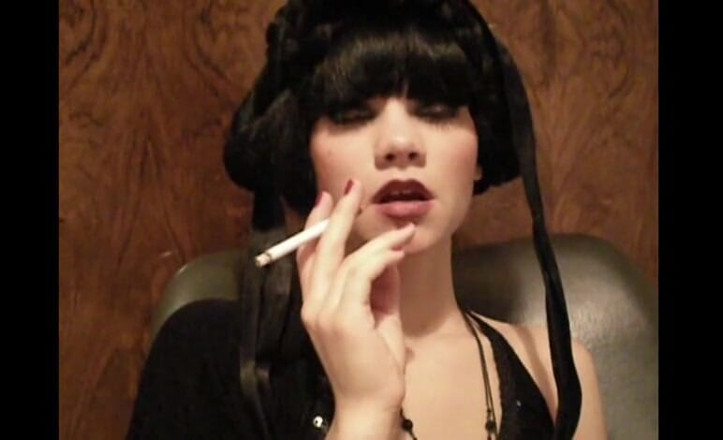 Femdom Austria: Glamorous beauty smoking a cigarette