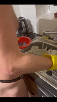 My Chastity Sub Washing the Pots for Me Naked in His Chastity Cage and with His Marigolds on