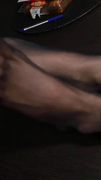 Shy Secretary Kerry Displays Her Nylon Feet on the Table