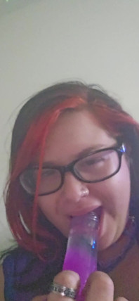 Sucking on a Big Purple Dildo