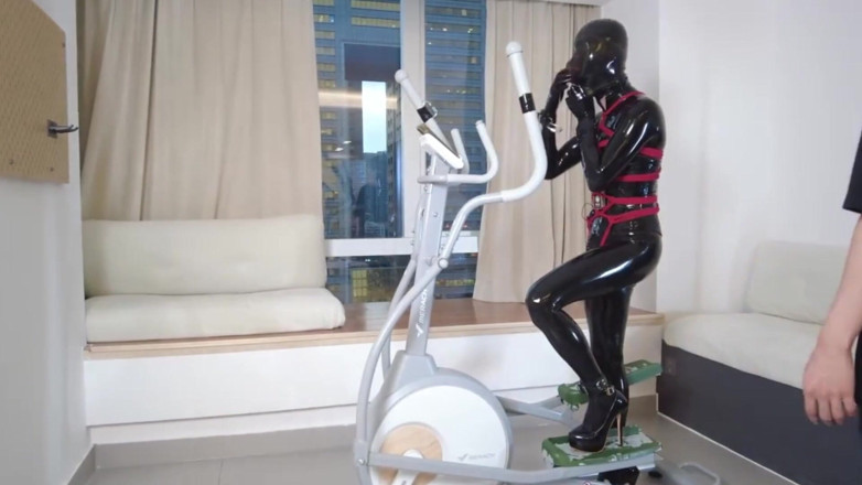 Aisan girl bondage: Mz27 - a Girl Bound in Latex Walks on a Treadmill