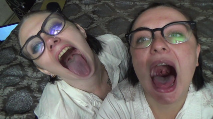 Goddess Misha Goldy: Two business women taunt you with their mouths & tongues before...