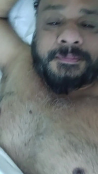 Indian Daddy Lying on the Bed Teasing and Posing for You