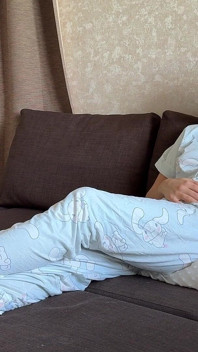Farting in Pajamas on a Pillow While Sitting on the Couch
