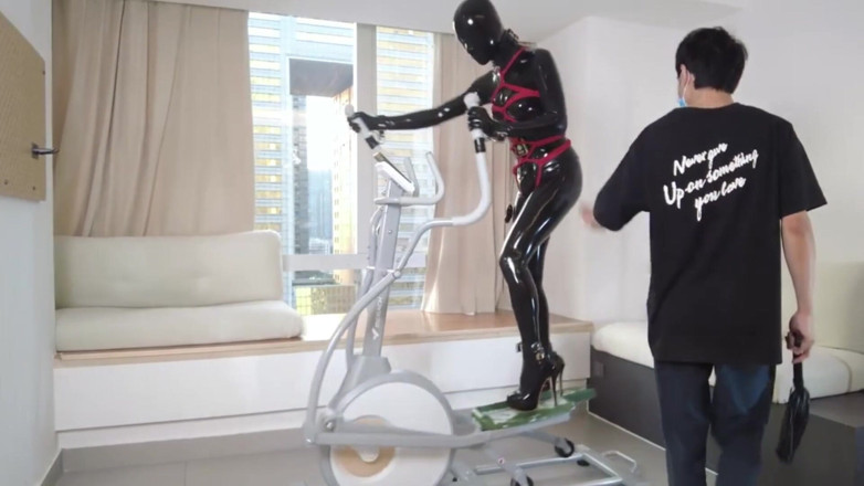 Aisan girl bondage: Mz27 - a Girl Bound in Latex Walks on a Treadmill