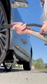 67 Tall Amazon Goddess Changes Her Tire - Big Feet in Frame