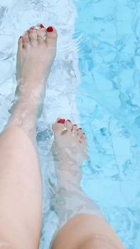 The Mistress Soaked Her Beautiful Feet in the Swimming Pool.