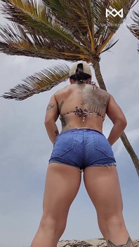 Giant Muscular Goddess on the Beach