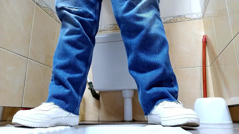 Elena: Hot MILF in jeans pissing in a public restroom