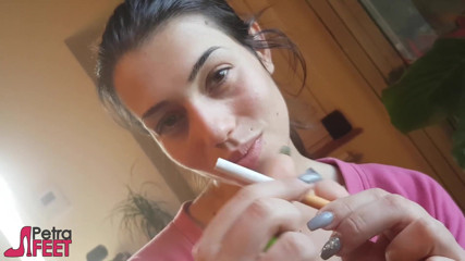 Smokin Fetish: Tempting Italian girl smokes a cigar in a close up...