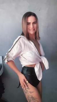 A Brunette in a White Shirt Is Ready to Bare Her Big Breasts