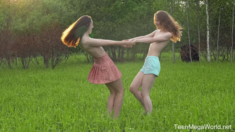 Teen Mega World: Hot Chicks Lick Clits in Field