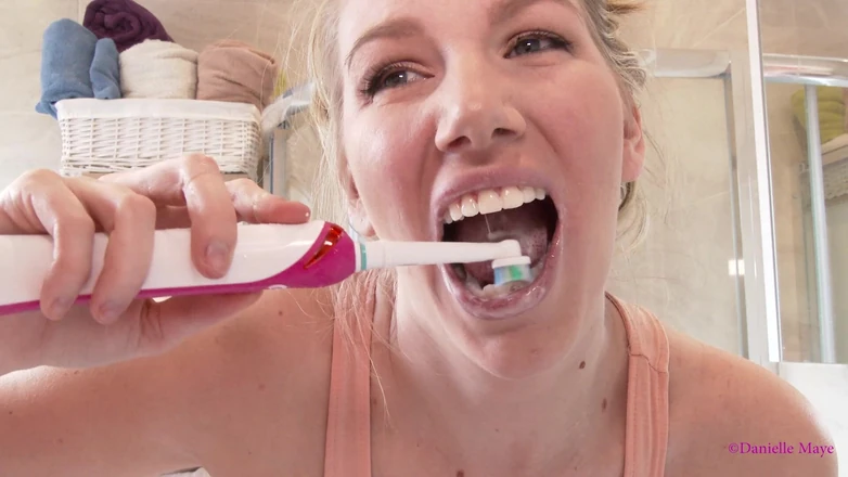 Danielle Maye: Pink Electric Toothbrush