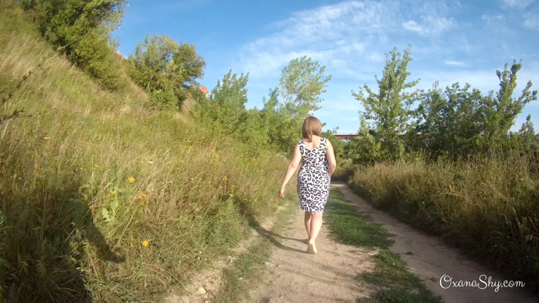 MILF Oxana: Flashing and naughty fun at the riverside