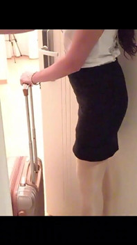 MILF in Stockings and Heels Walks Through the Corridors of a Hotel