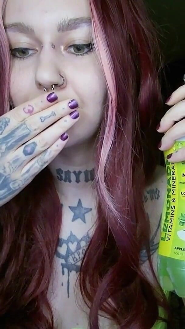 Sexy Alternative Redhead Drinking Soda and Burping (Horror circus) Sexy Alternative Redhead Drinking Soda and Burping (Horror circus)