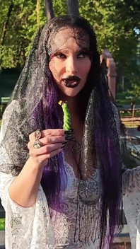 Gothic Witch Wanders the Cemetery, Performs Black Magic Rituals, and Makes You to Worship Her and Satan.