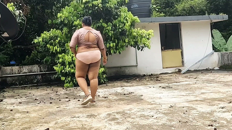 Anne Ipe: A Full-figured Woman in a White Skirt and Pink Top...