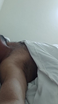 Indian Daddy Lying on the Bed Teasing and Posing for You