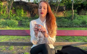 Liz Rainbow Smoking a Flor De Oliva Cigar Outdoors
